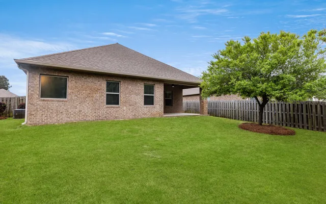 a view of a swimming pool and lounge chair