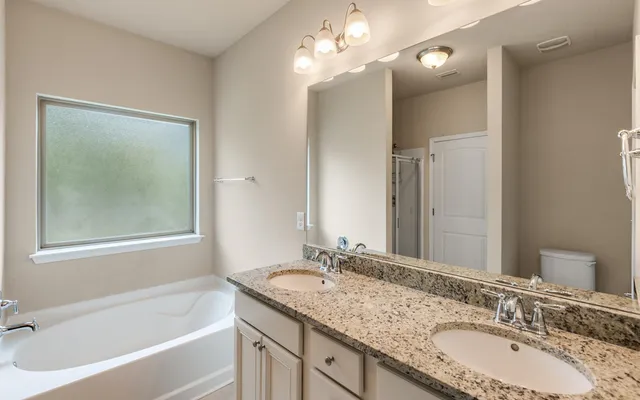a view of a chairs and table in the balcony