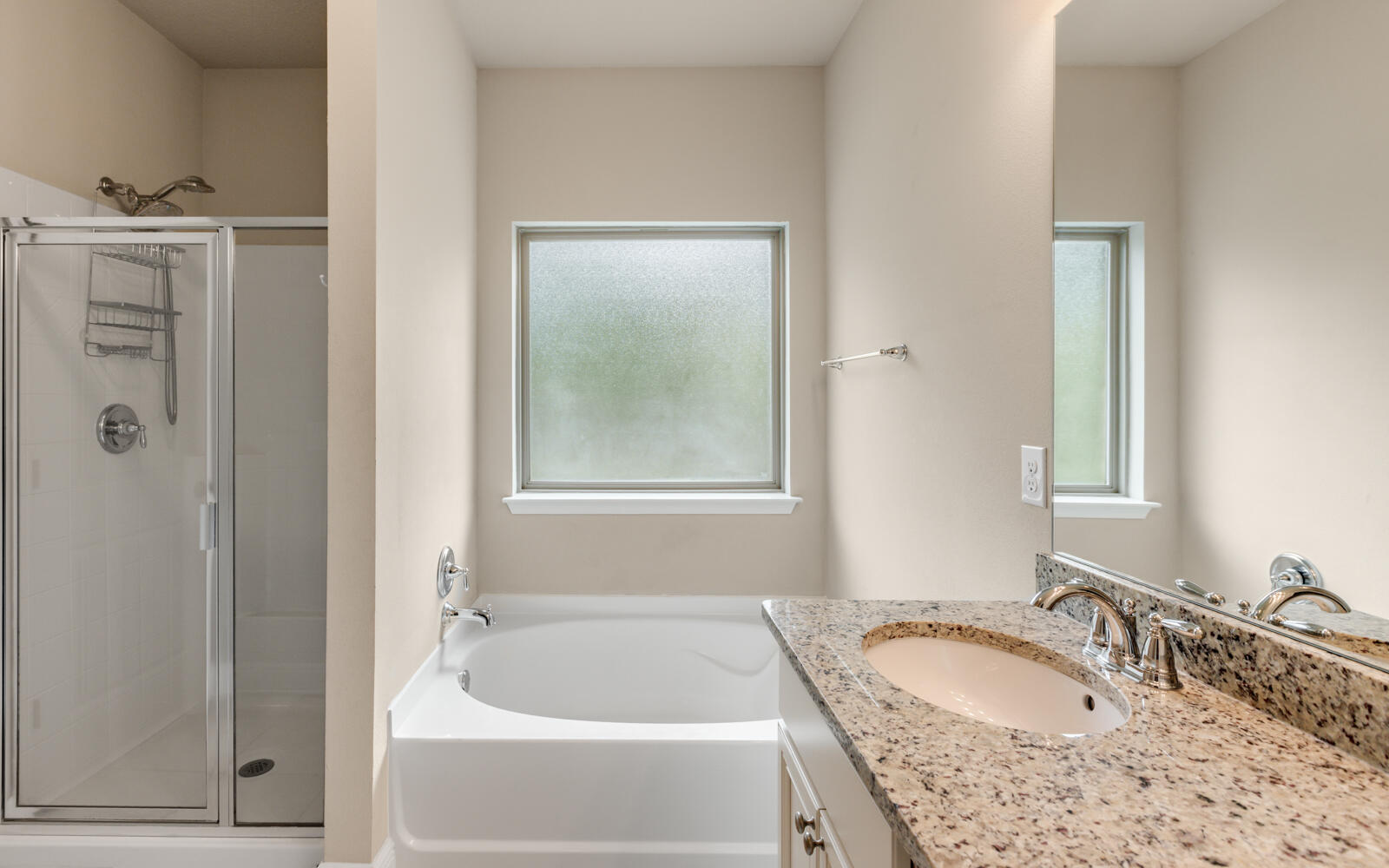 379 Whitman Way Freeport, FL 32439 - Photo 38 of 97 a bathroom with a granite countertop tub sink and mirror