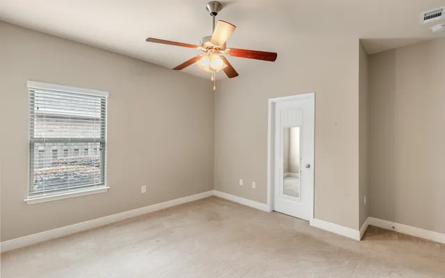 a dining room with wooden floor and furniture