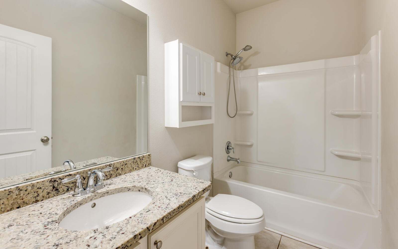 379 Whitman Way Freeport, FL 32439 - Photo 44 of 97 a bathroom with a granite countertop sink a toilet and shower