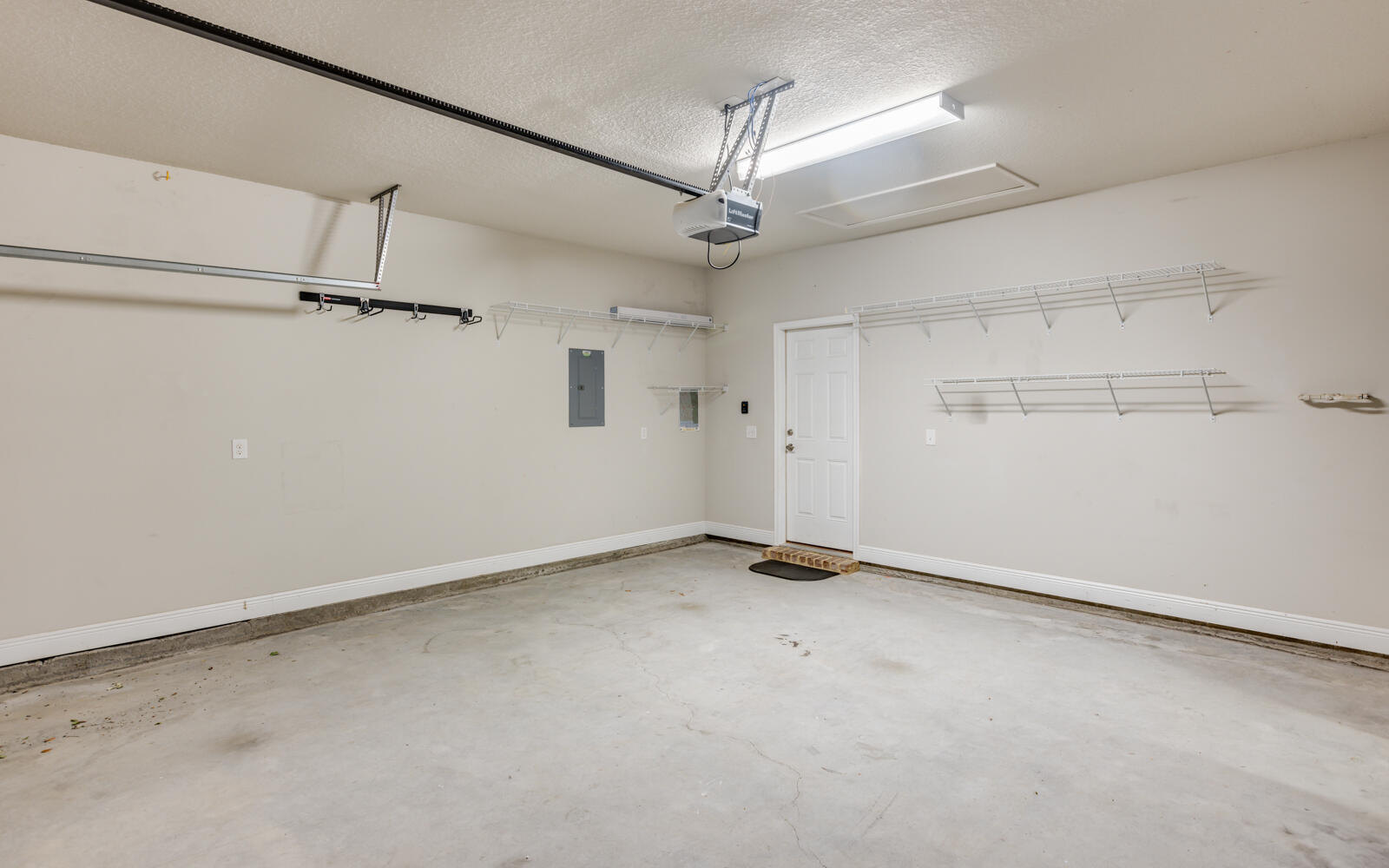 379 Whitman Way Freeport, FL 32439 - Photo 51 of 97 an empty room with a ceiling fan and windows