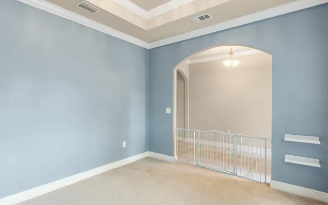 a kitchen with granite countertop white cabinets sink and stainless steel appliances