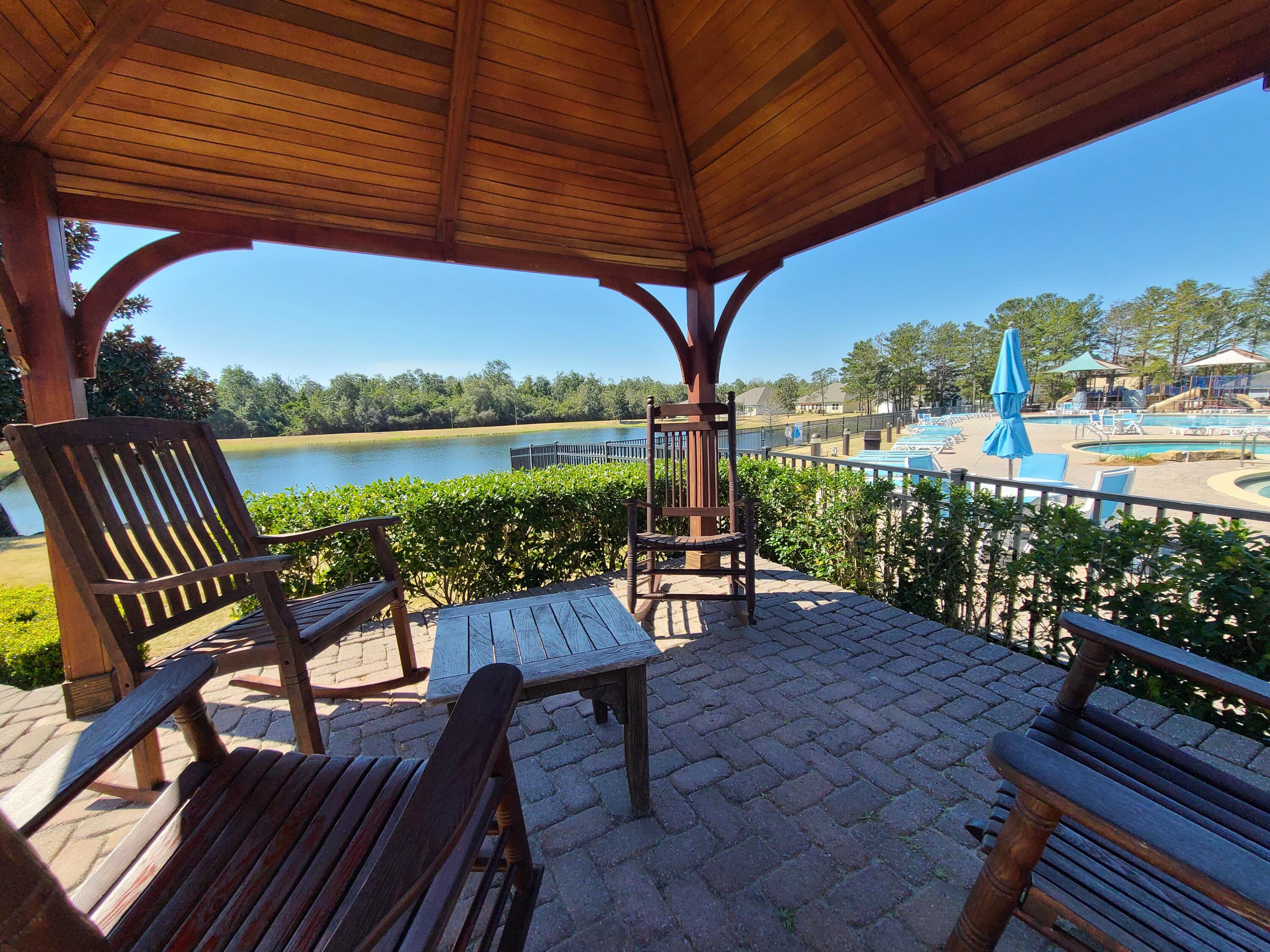379 Whitman Way Freeport, FL 32439 - Photo 75 of 97 a view of a chairs and table in the balcony