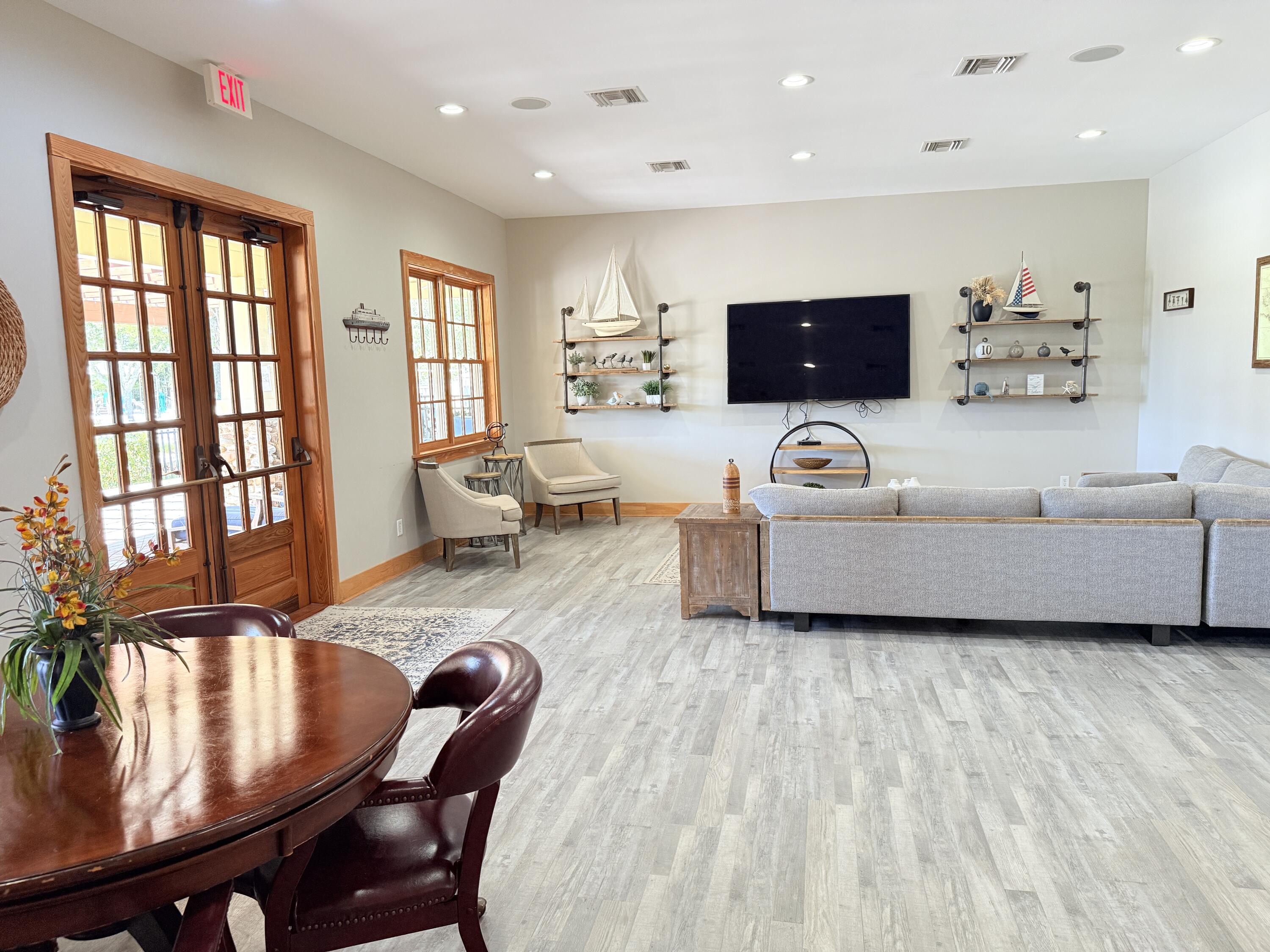 379 Whitman Way Freeport, FL 32439 - Photo 79 of 97 a living room with furniture and a flat screen tv