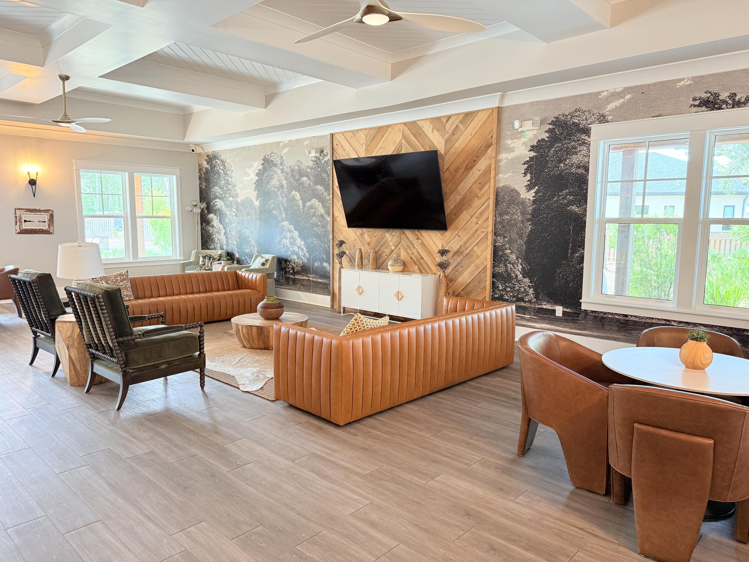 379 Whitman Way Freeport, FL 32439 - Photo 90 of 97 a living room with furniture a flat screen tv and a large window