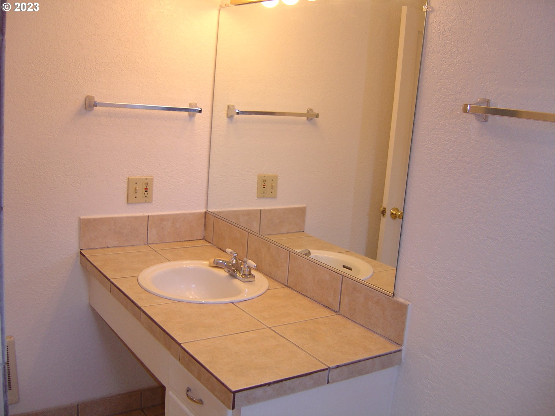 710 26th Street Springfield, OR 97477 - Photo 19 of 48 a bathroom with a sink and a mirror