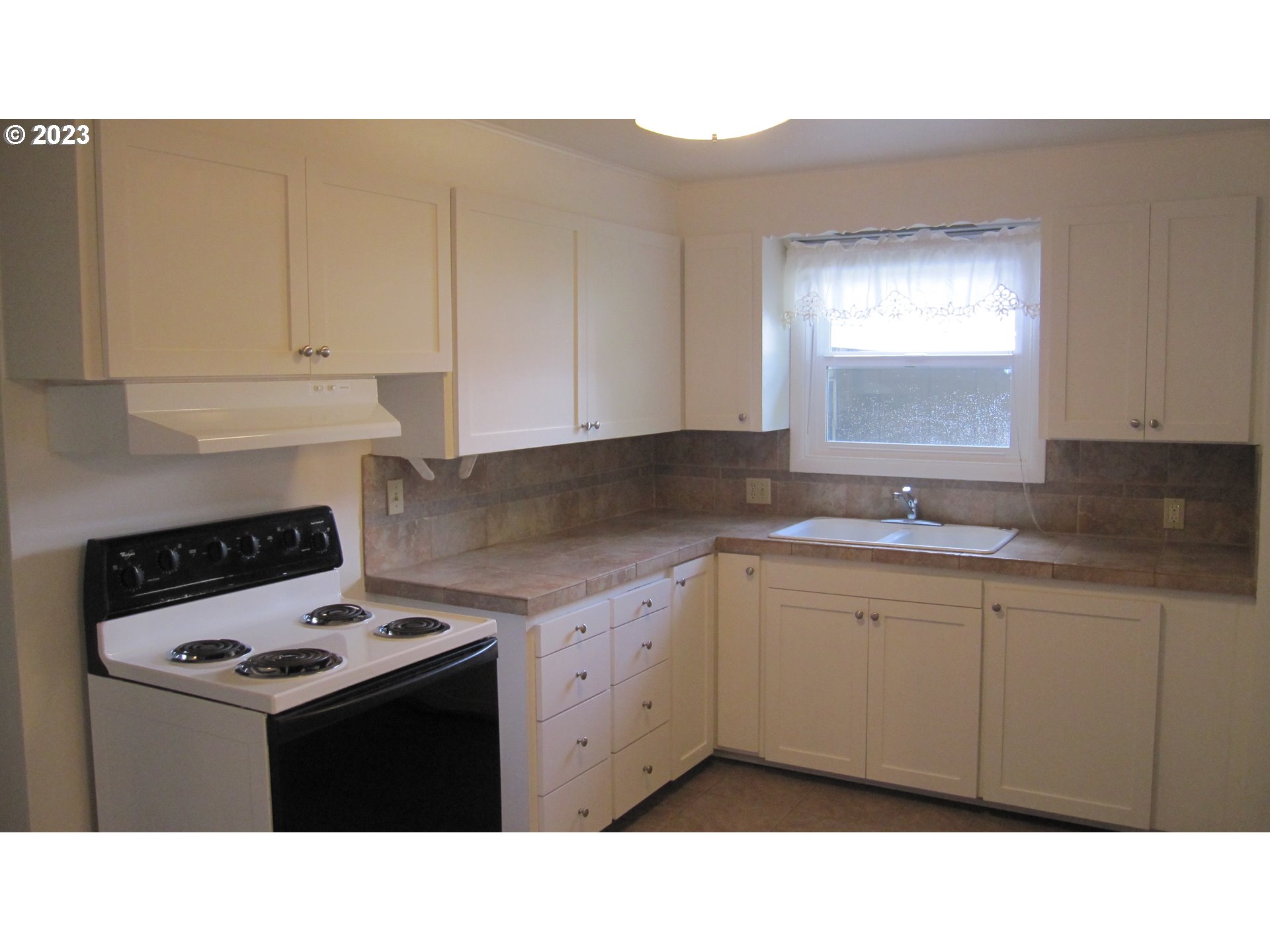 710 26th Street Springfield, OR 97477 - Photo 23 of 48 a kitchen with a sink cabinets and window