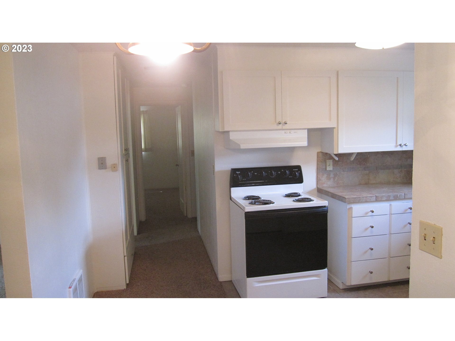710 26th Street Springfield, OR 97477 - Photo 26 of 48 a kitchen with a stove and a refrigerator