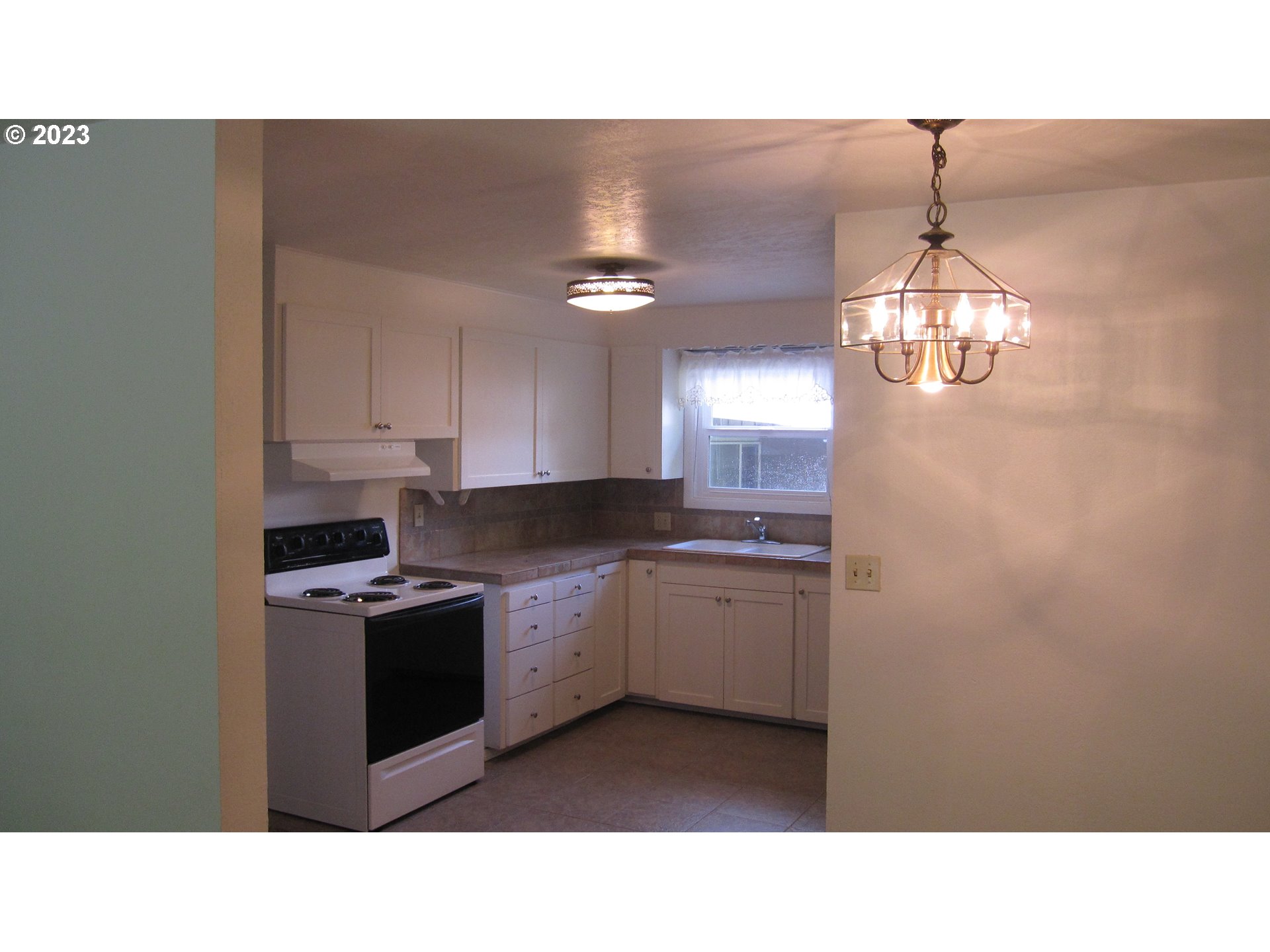 710 26th Street Springfield, OR 97477 - Photo 29 of 48 a kitchen with sink and cabinets