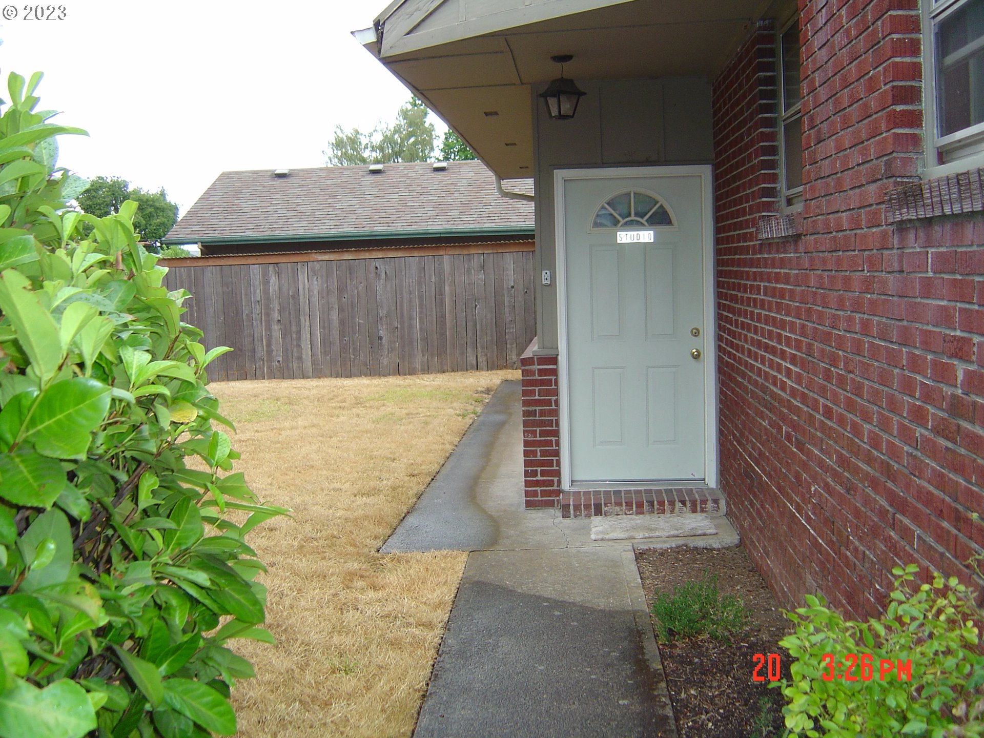 710 26th Street Springfield, OR 97477 - Photo 33 of 48 a view of a wooden door with a yard