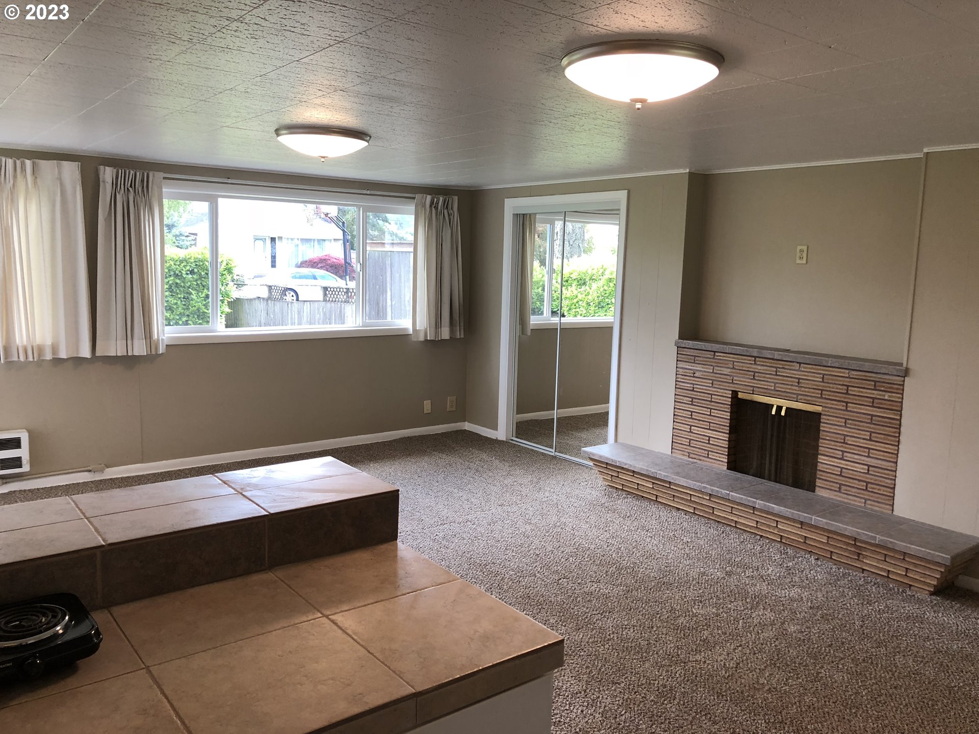 710 26th Street Springfield, OR 97477 - Photo 35 of 48 a living room with furniture and a fireplace