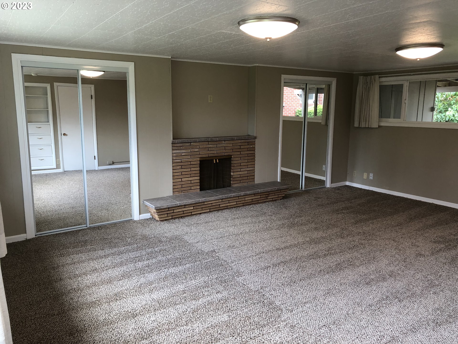 710 26th Street Springfield, OR 97477 - Photo 36 of 48 an empty room with windows and fireplace
