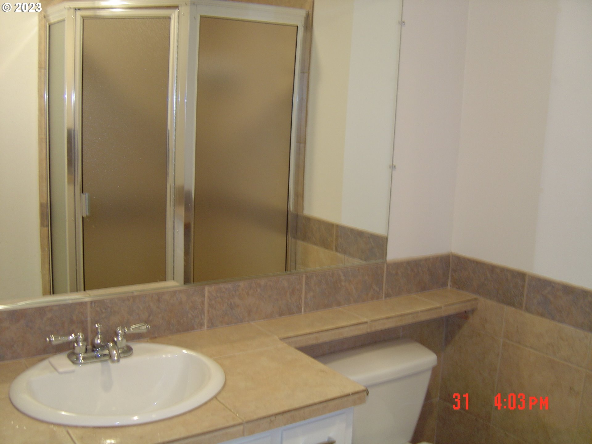 710 26th Street Springfield, OR 97477 - Photo 37 of 48 a bathroom with a sink and a mirror