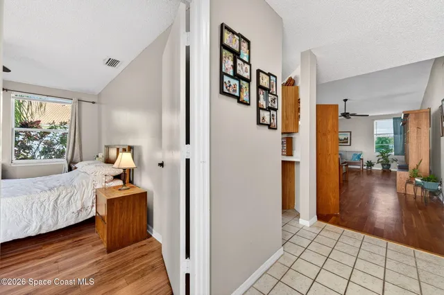 a bedroom with a bed and a table