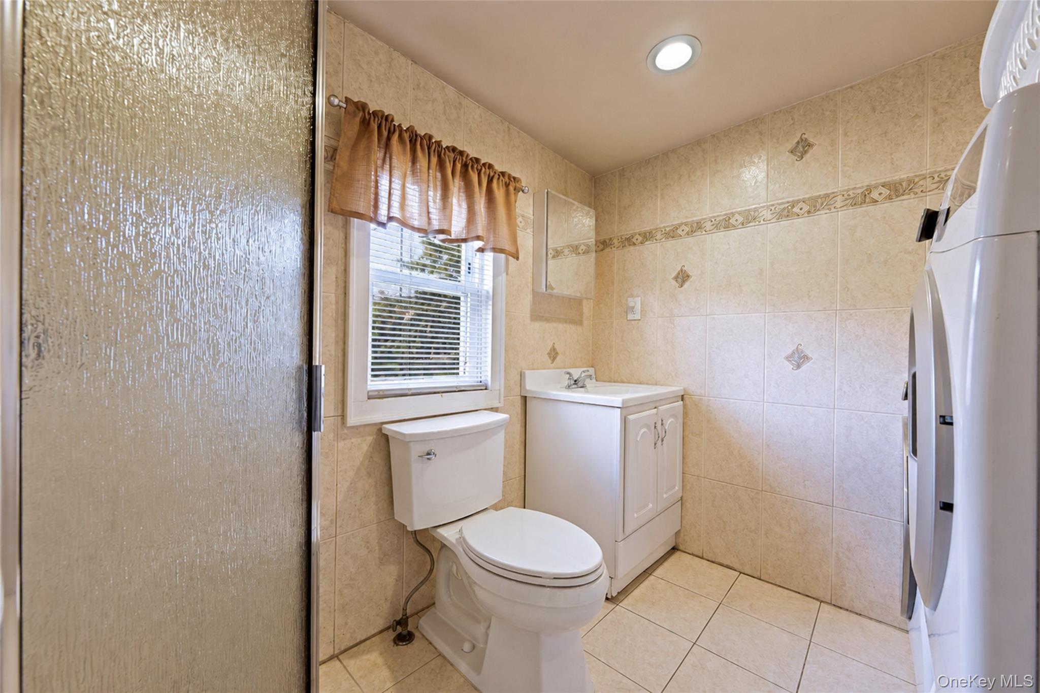 80 George Street Babylon, NY 11702 - Photo 16 of 41 a bathroom with a toilet and a shower