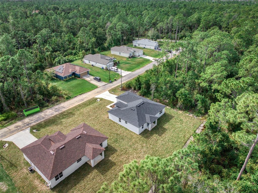 8736 Capilla Street Sebring, FL 33872 - Photo 3 of 60 an aerial view of a house with an outdoor space