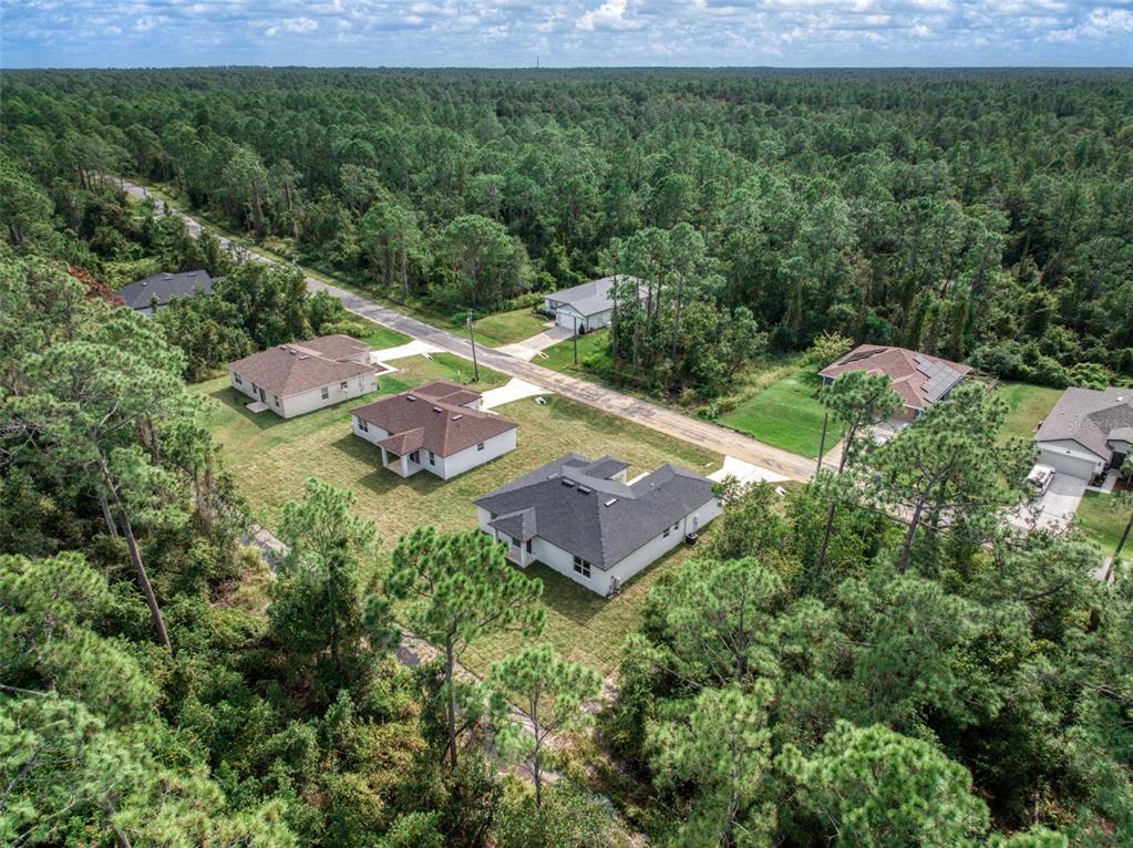 8736 Capilla Street Sebring, FL 33872 - Photo 55 of 60 an aerial view of a house with a yard