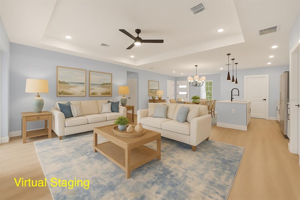 8736 Capilla Street Sebring, FL 33872 - Photo 10 of 60 a living room with furniture and a view of kitchen