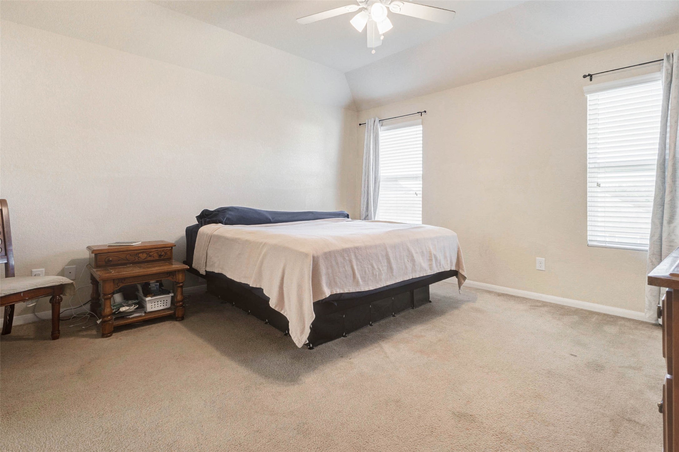 3027 Upland Spring Trace Katy, TX 77493 - Photo 16 of 29 a bed sitting in a bedroom next to a window