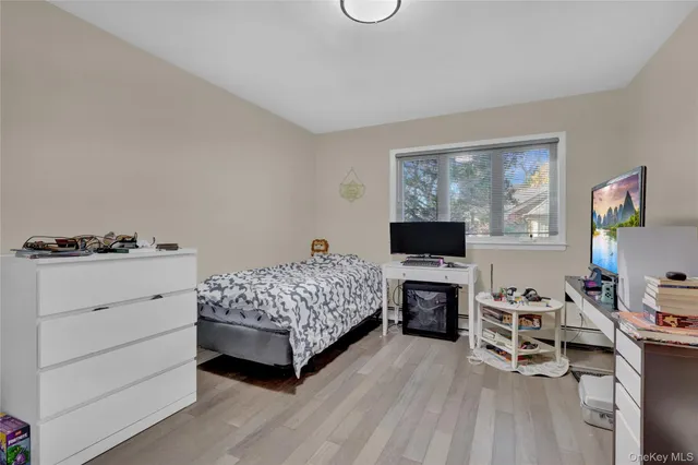 a bedroom with a bed and a tv in it