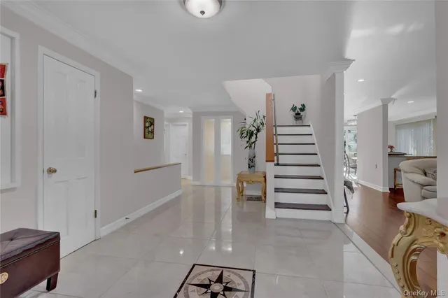 a view of entryway with livingroom and stairs