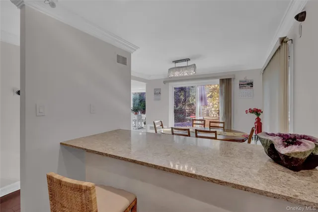 a dining room with table and chairs