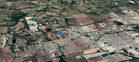 an aerial view of a residential houses with outdoor space