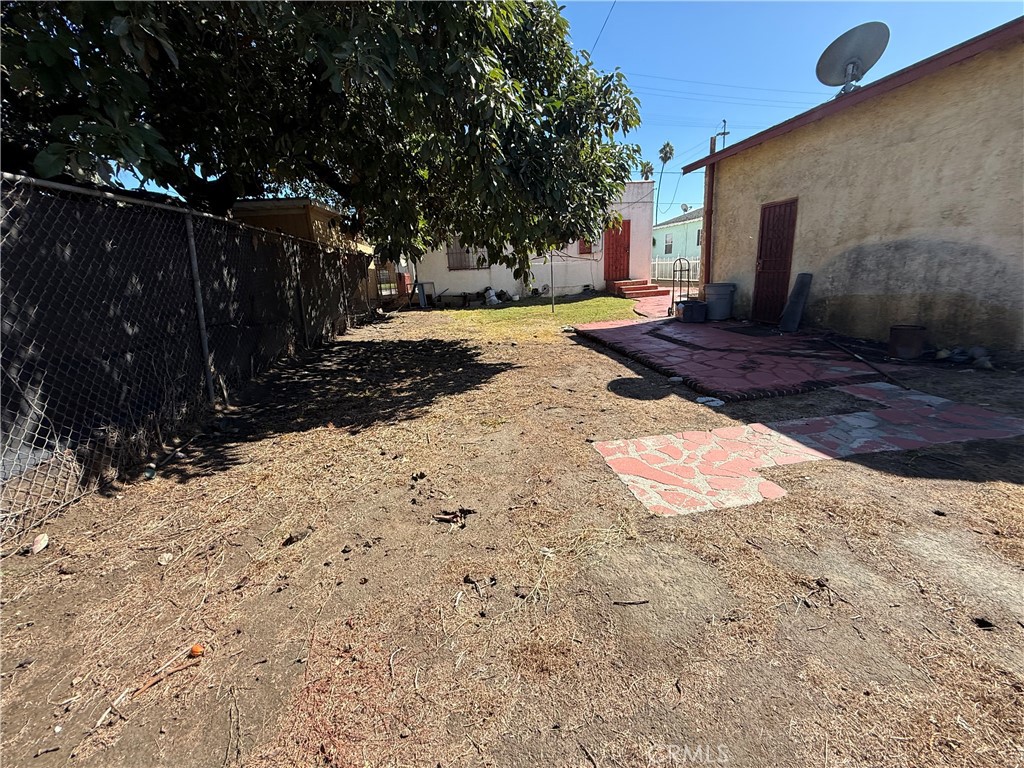 1317 South Temple Avenue Compton, CA 90221 - Photo 3 of 13 a view of backyard with tree