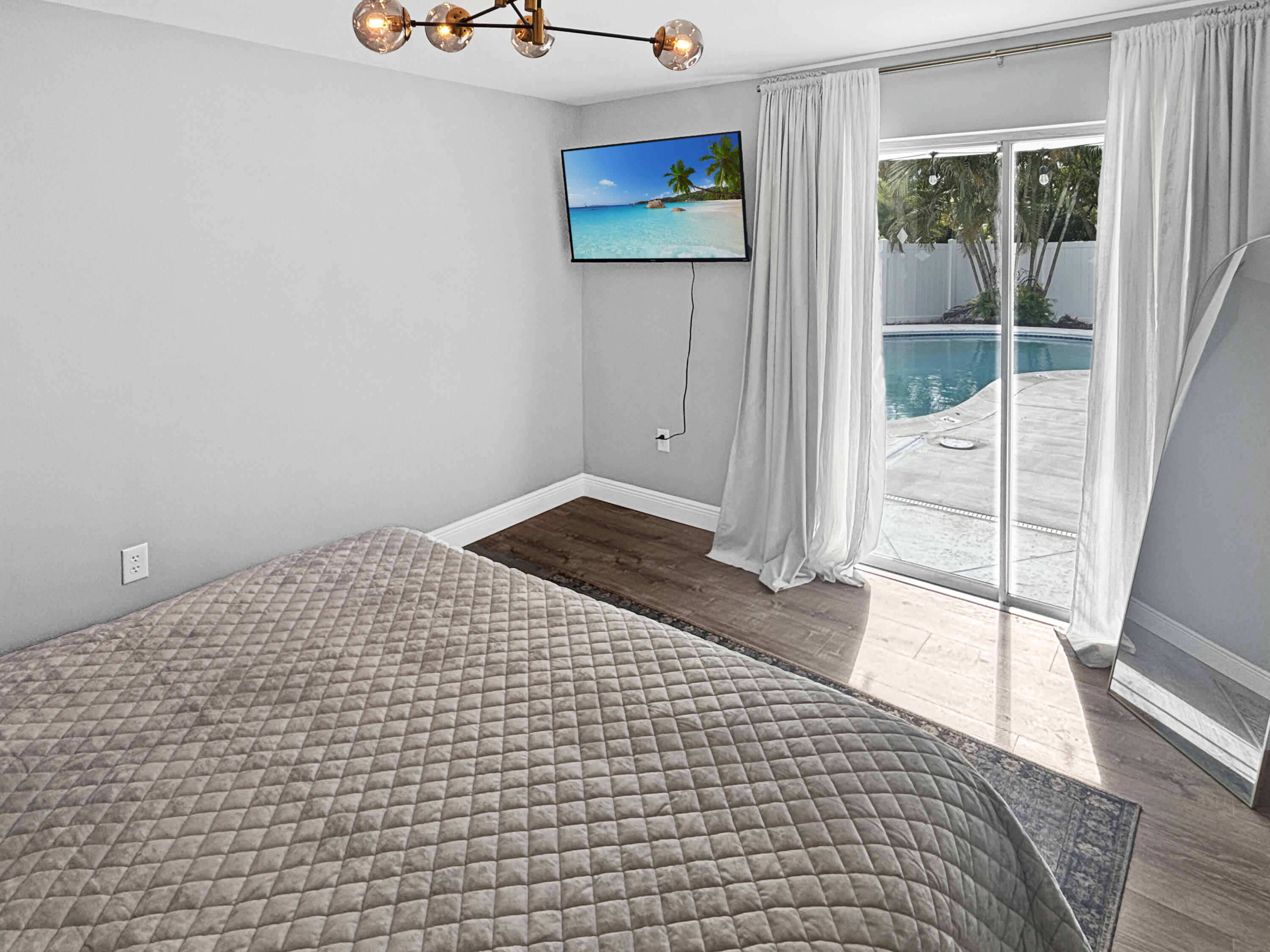 100 Southwest 17th Street Pompano Beach, FL 33060 - Photo 11 of 20 a view of a room with wooden floor and windows