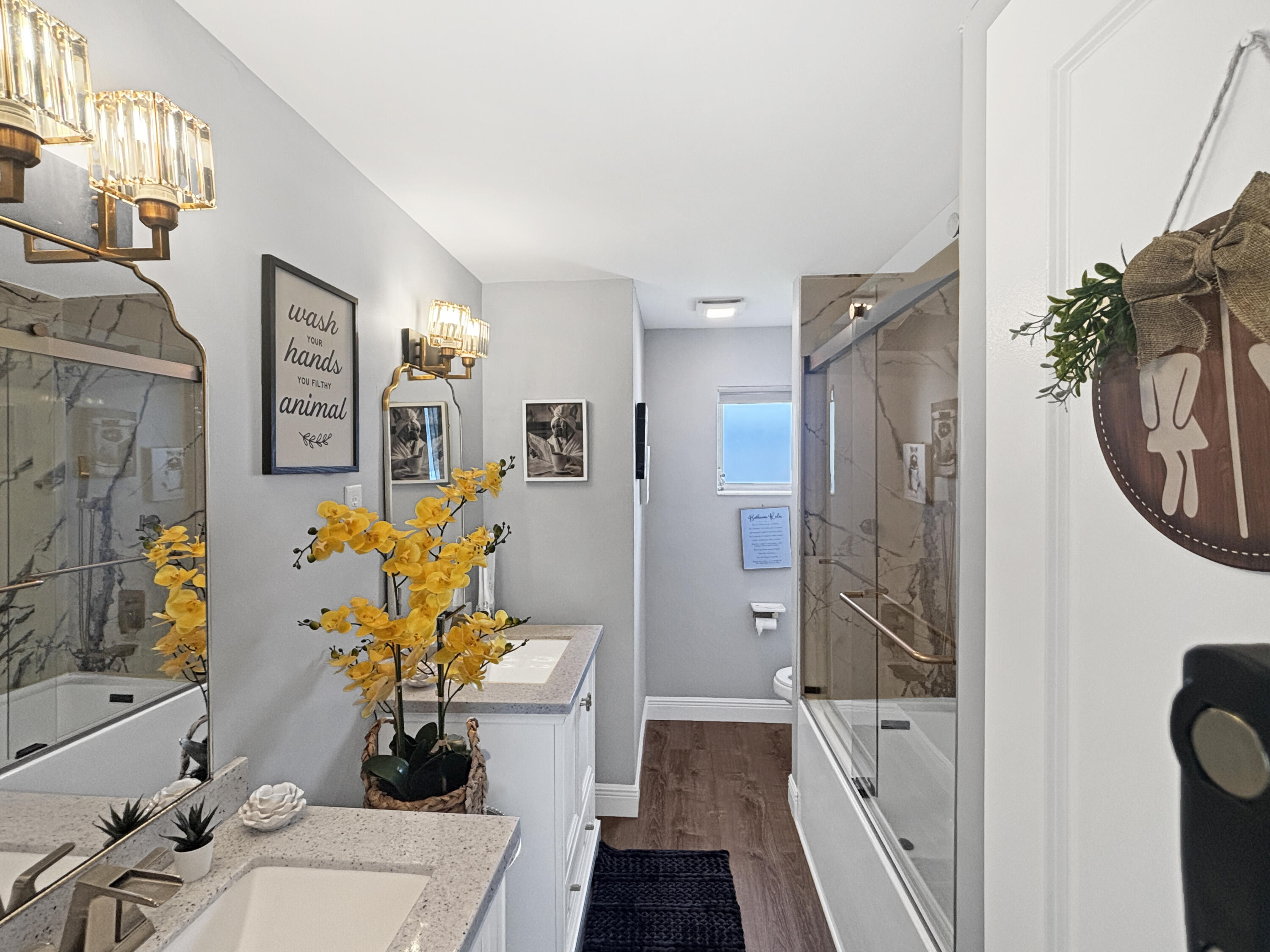 100 Southwest 17th Street Pompano Beach, FL 33060 - Photo 13 of 20 a bath room with a sink a couch and a potted plant
