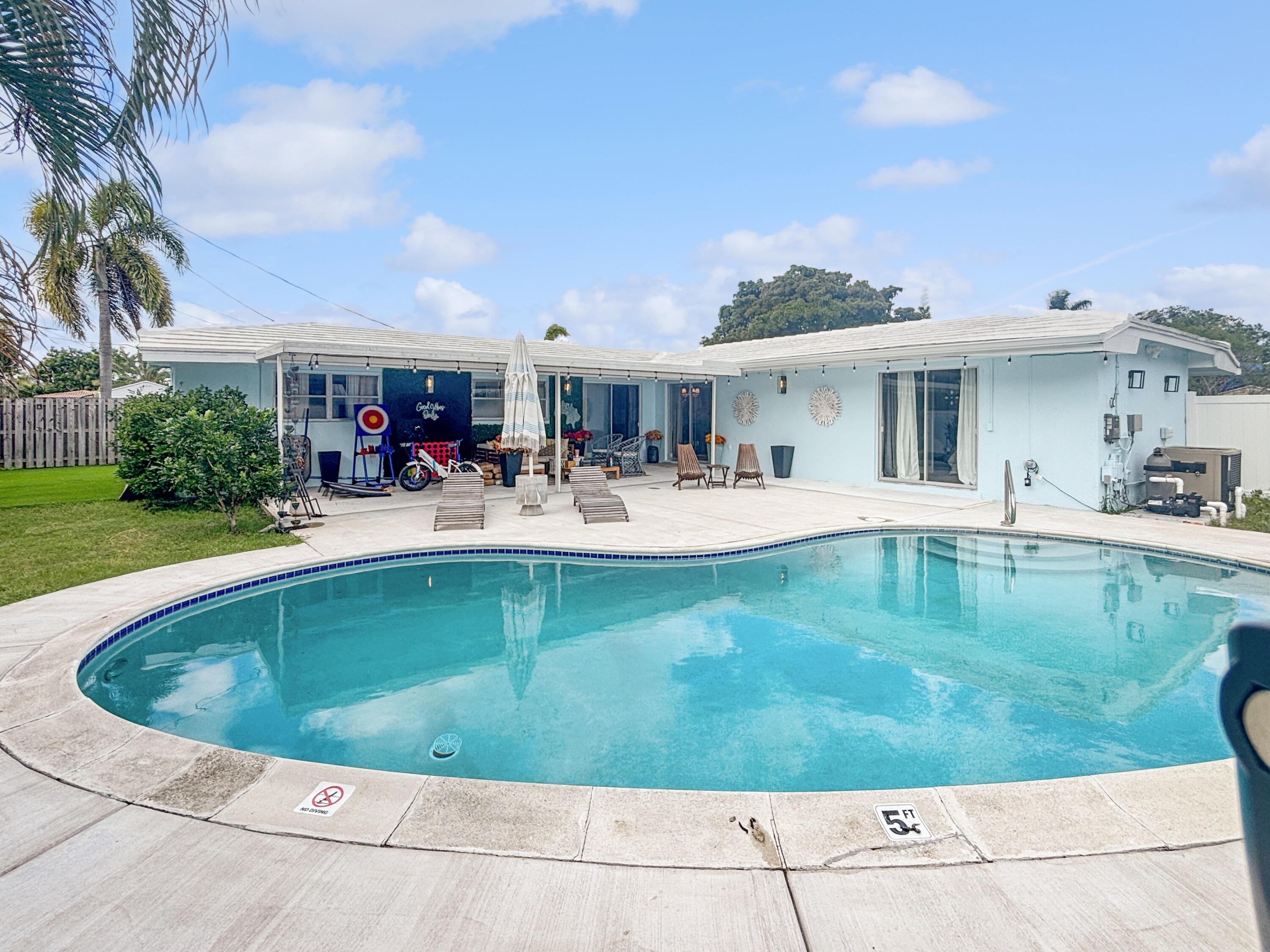 100 Southwest 17th Street Pompano Beach, FL 33060 - Photo 14 of 20 a view of a swimming pool with outdoor seating