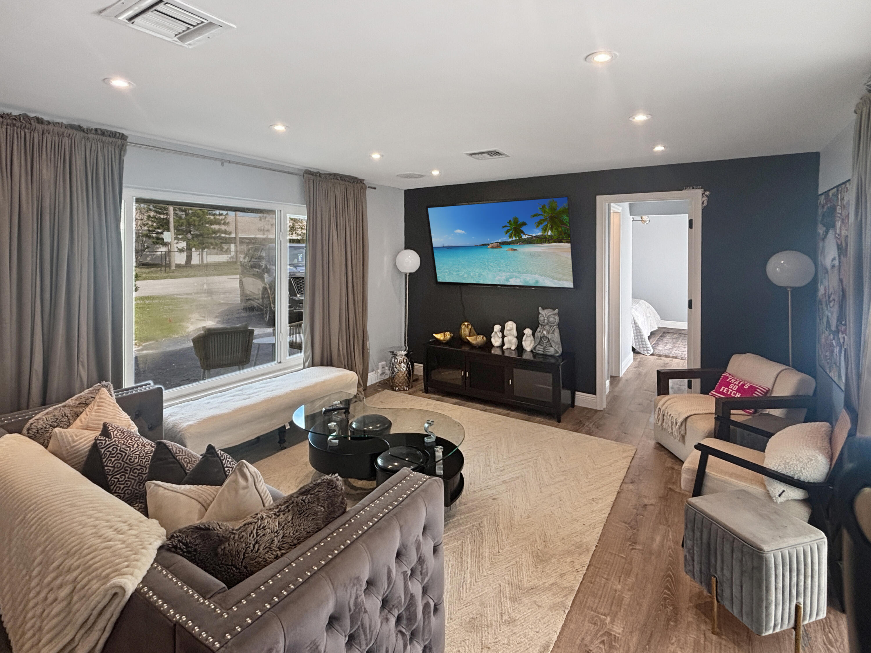100 Southwest 17th Street Pompano Beach, FL 33060 - Photo 5 of 20 a living room with furniture and a flat screen tv