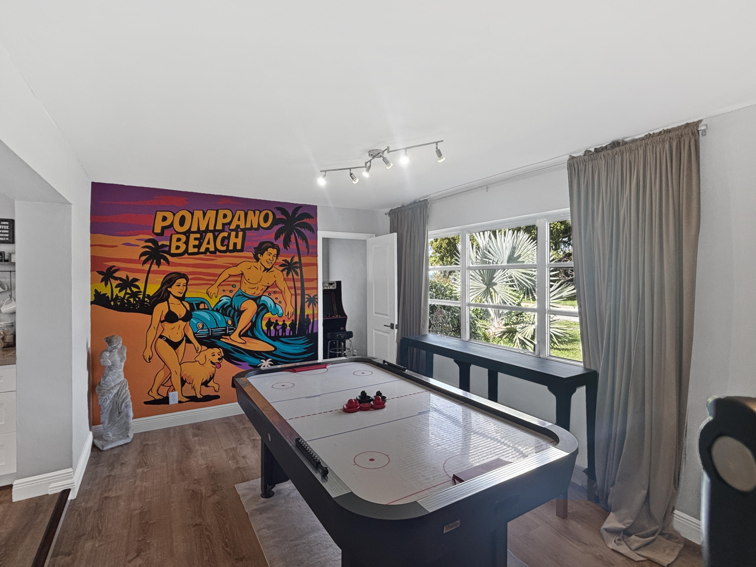 100 Southwest 17th Street Pompano Beach, FL 33060 - Photo 7 of 20 a view of a dining room with furniture a chandelier and wooden floor