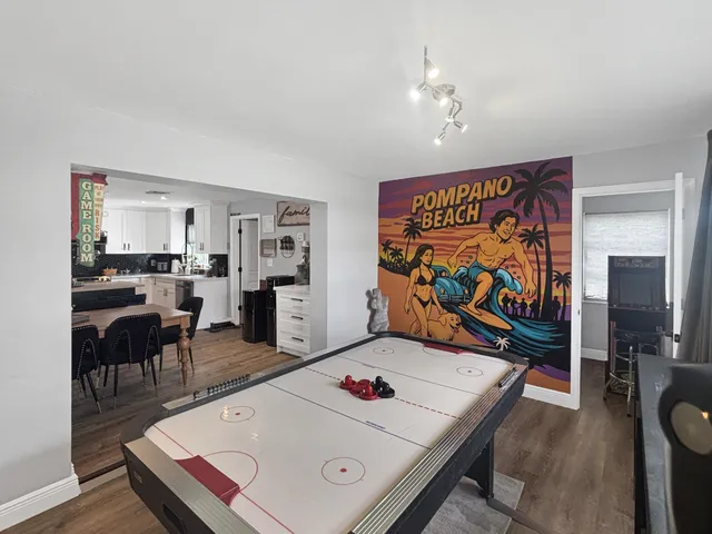 a living room with furniture and flat screen tv