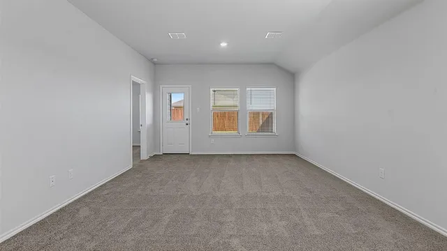 a view of a kitchen with a refrigerator and a sink