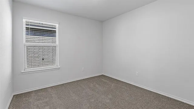 a bathroom with a bathtub and toilet