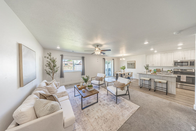 4991 South 475 West Washington Terrace, UT 84405 - Photo 10 of 31 Open concept living area showing spaciousness.