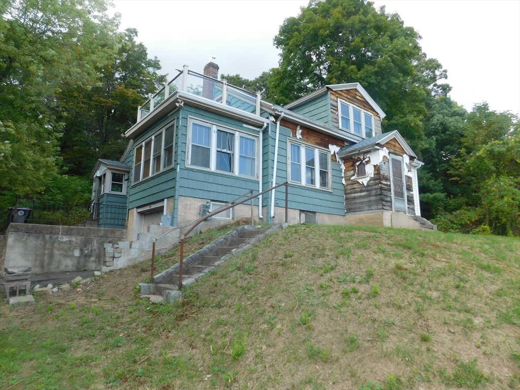 641 Northampton Street Holyoke, MA 01040 - Photo 1 of 19 a front view of a house with a yard