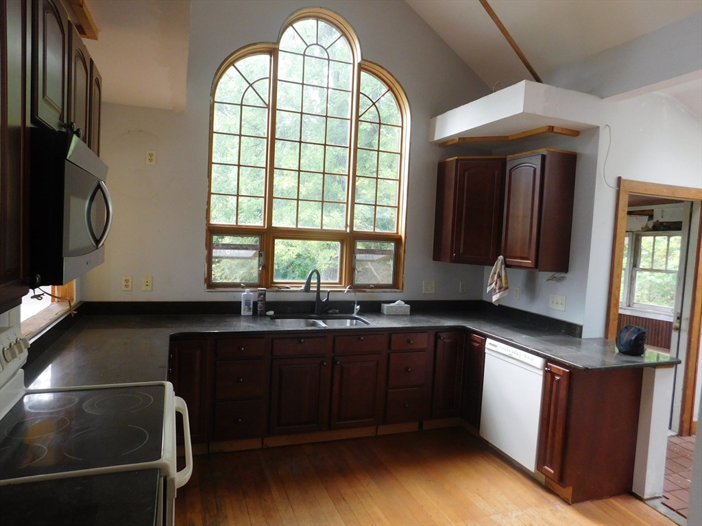 641 Northampton Street Holyoke, MA 01040 - Photo 6 of 19 a kitchen with large windows and sink