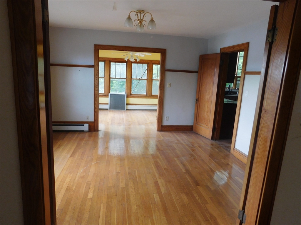 641 Northampton Street Holyoke, MA 01040 - Photo 10 of 19 a view of hallway with wooden floor and stairs