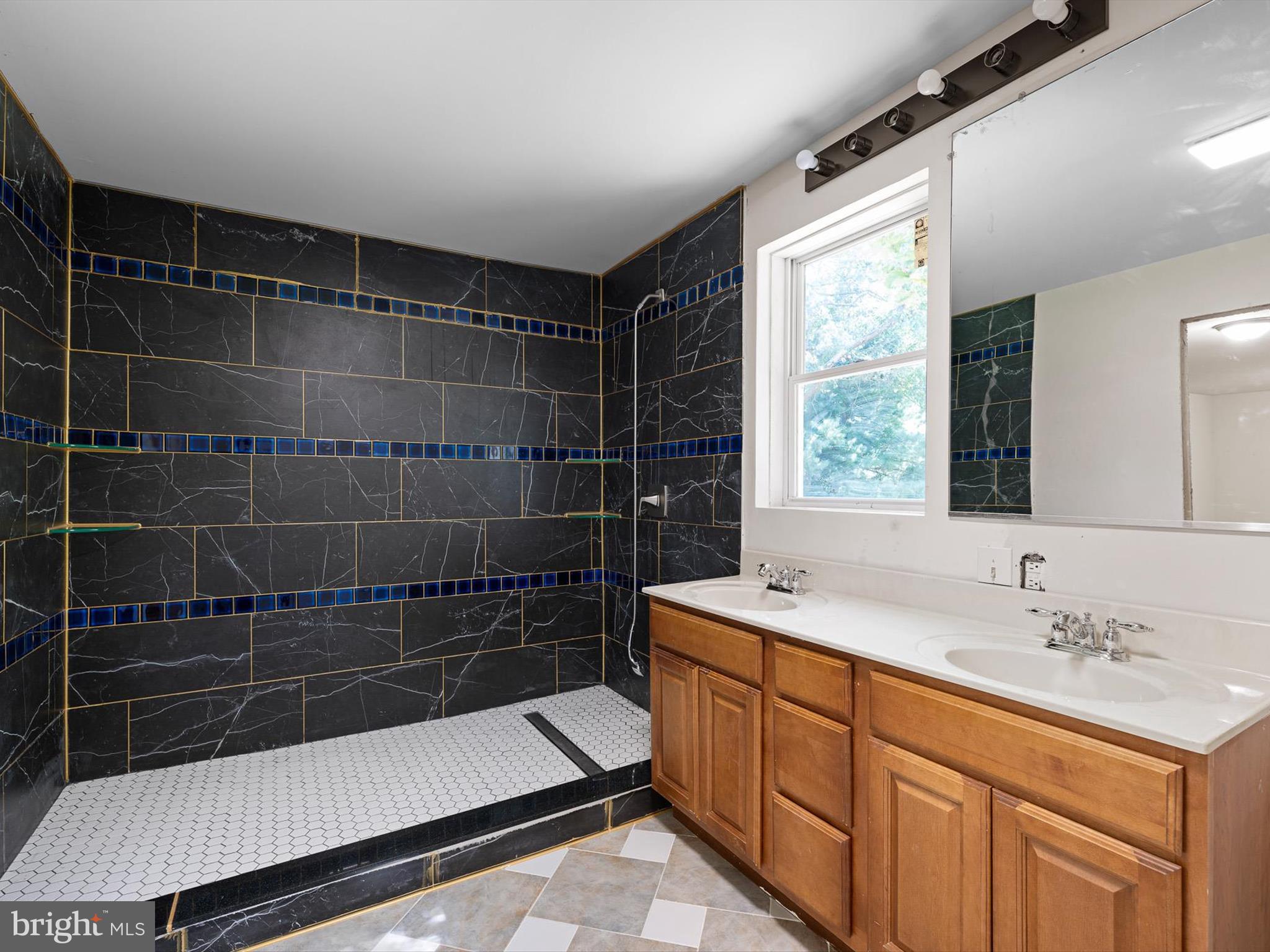 16327 Old Mill Road Lewes, DE 19958 - Photo 16 of 35 a bathroom with a sink toilet and shower