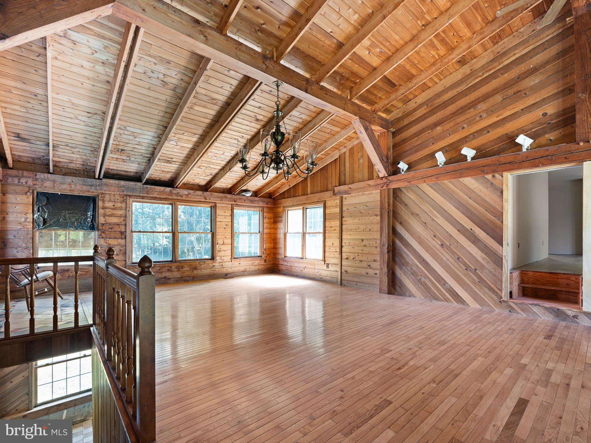 16327 Old Mill Road Lewes, DE 19958 - Photo 20 of 35 a view of an empty room with wooden floor and a window