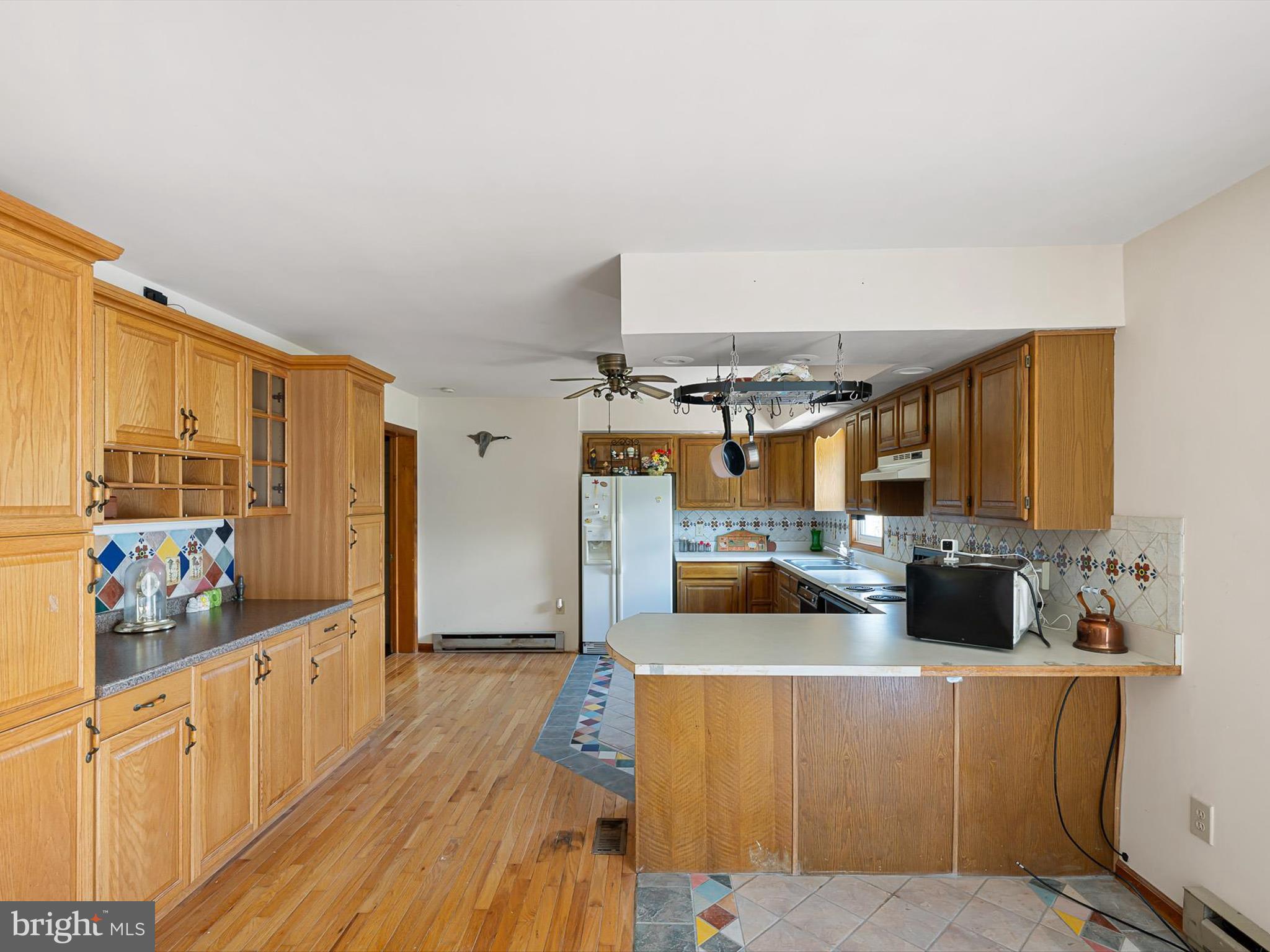 16327 Old Mill Road Lewes, DE 19958 - Photo 24 of 35 a kitchen with stainless steel appliances a stove a sink and a refrigerator