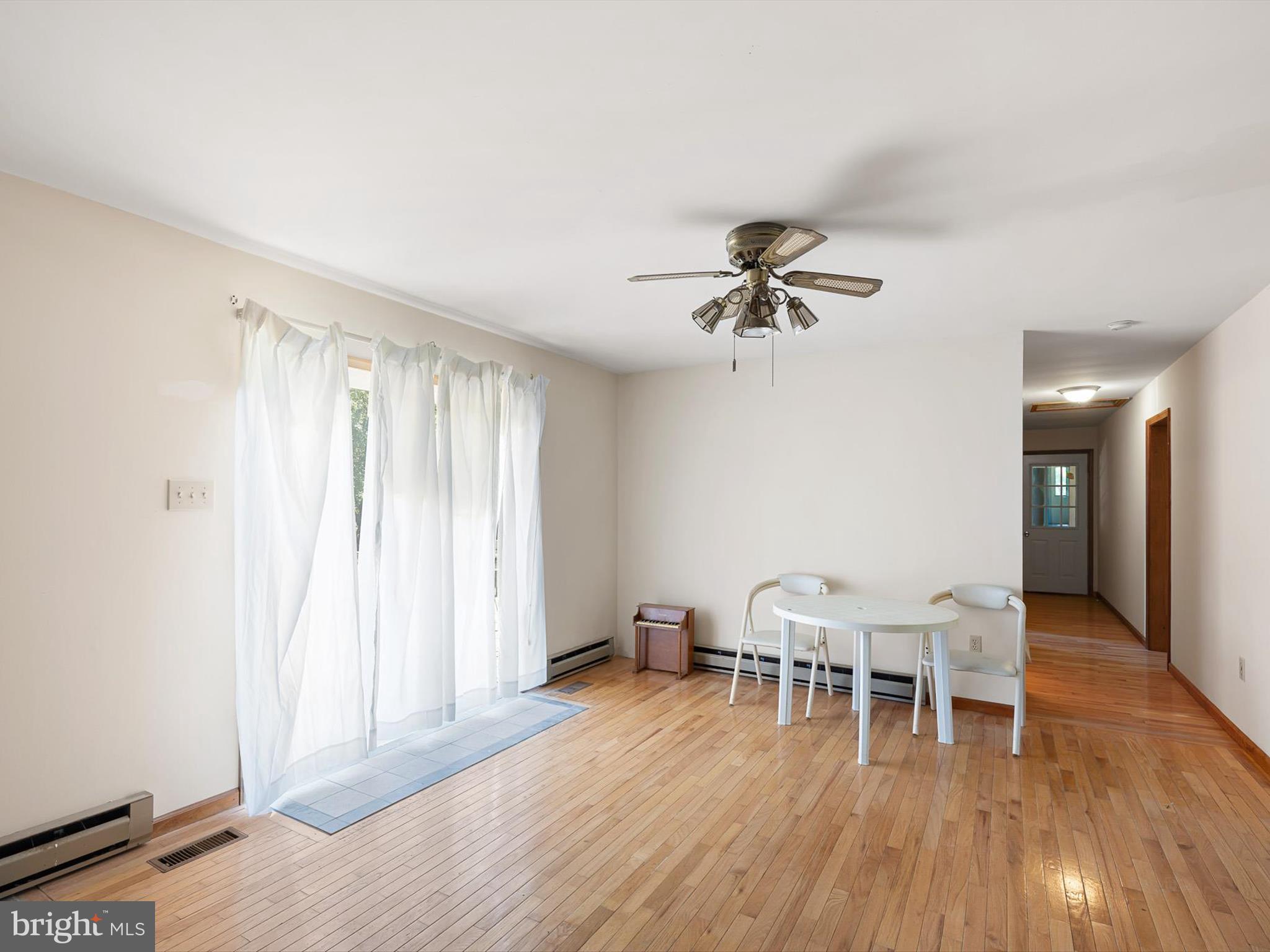 16327 Old Mill Road Lewes, DE 19958 - Photo 25 of 35 a view of a livingroom with furniture and a ceiling fan