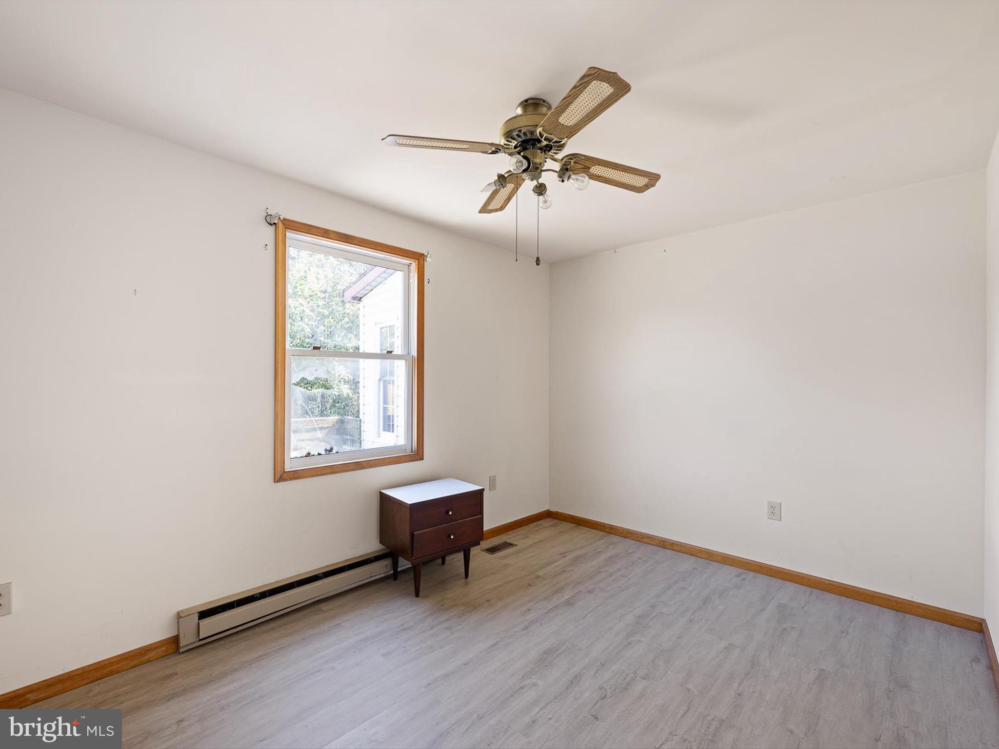 16327 Old Mill Road Lewes, DE 19958 - Photo 30 of 35 a view of an empty room with wooden floor and a window