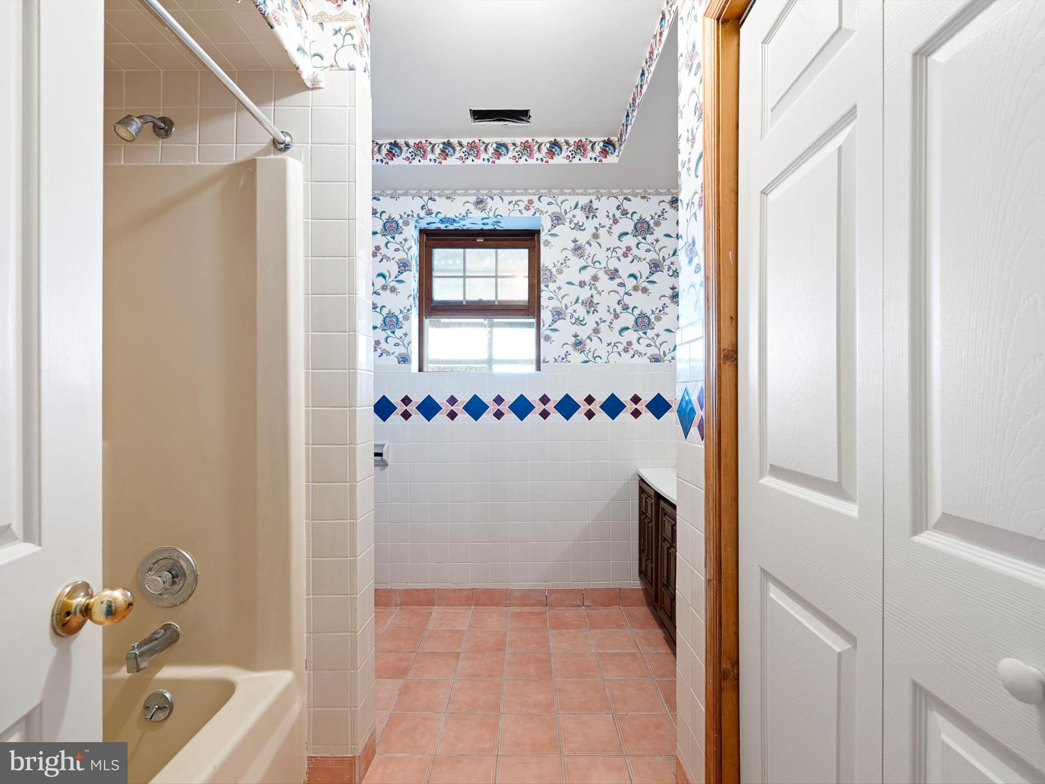 16327 Old Mill Road Lewes, DE 19958 - Photo 3 of 35 a bathroom with a tub and a shower