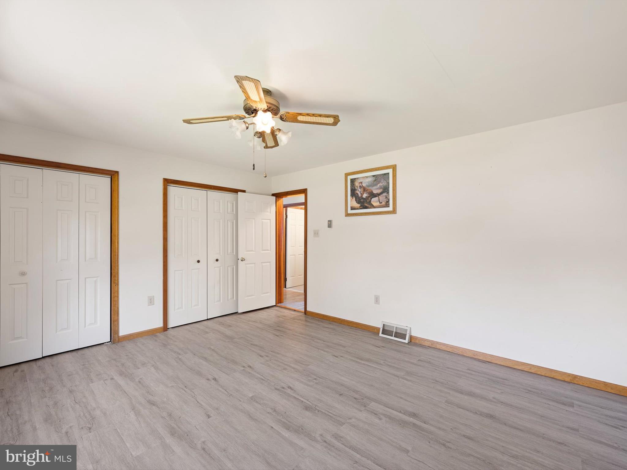 16327 Old Mill Road Lewes, DE 19958 - Photo 31 of 35 a view of an empty room with wooden floor