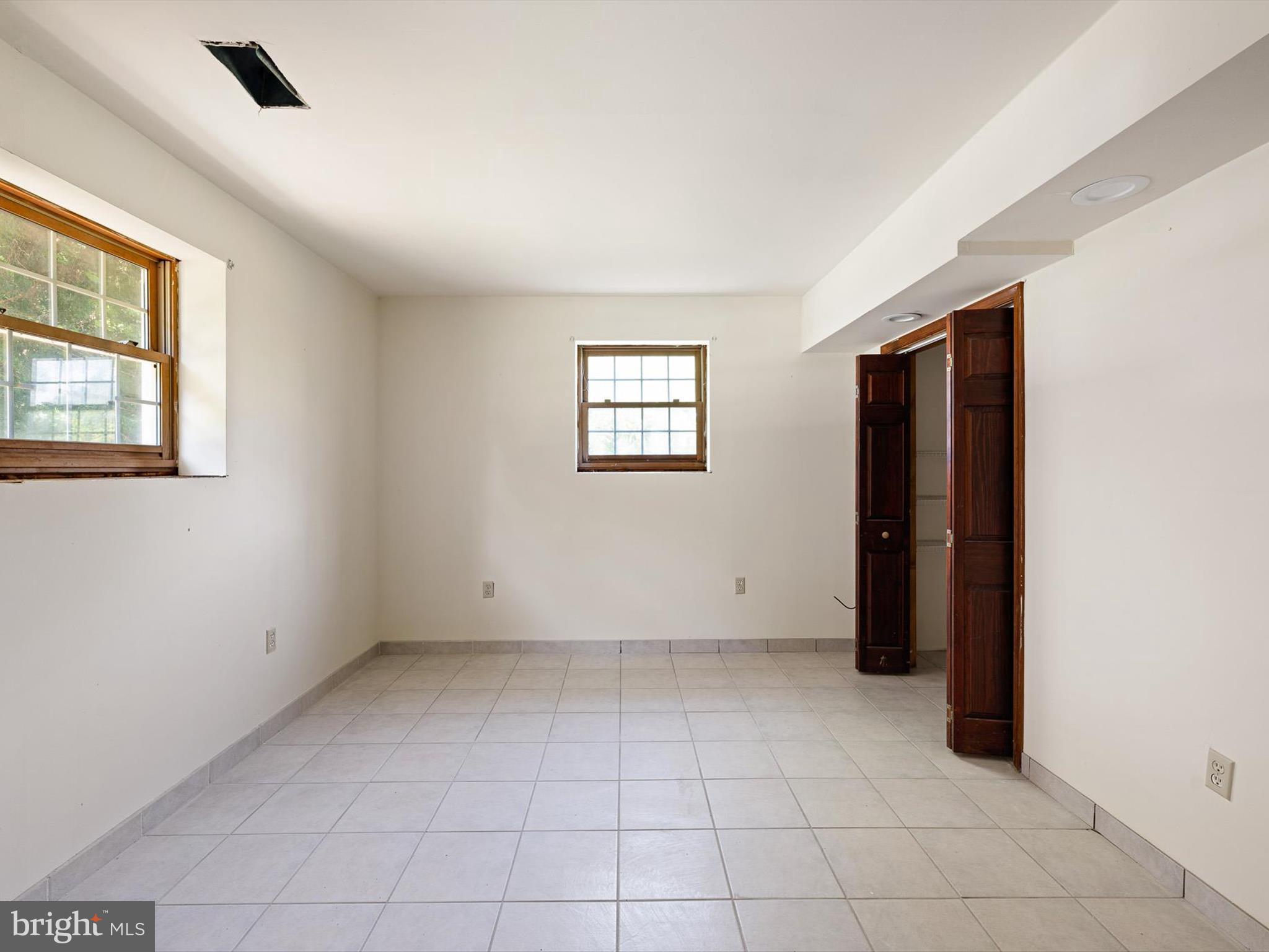 16327 Old Mill Road Lewes, DE 19958 - Photo 5 of 35 a view of an empty room with a window