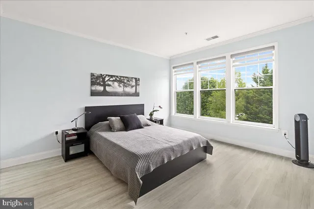a view of a balcony with chair and iron fence
